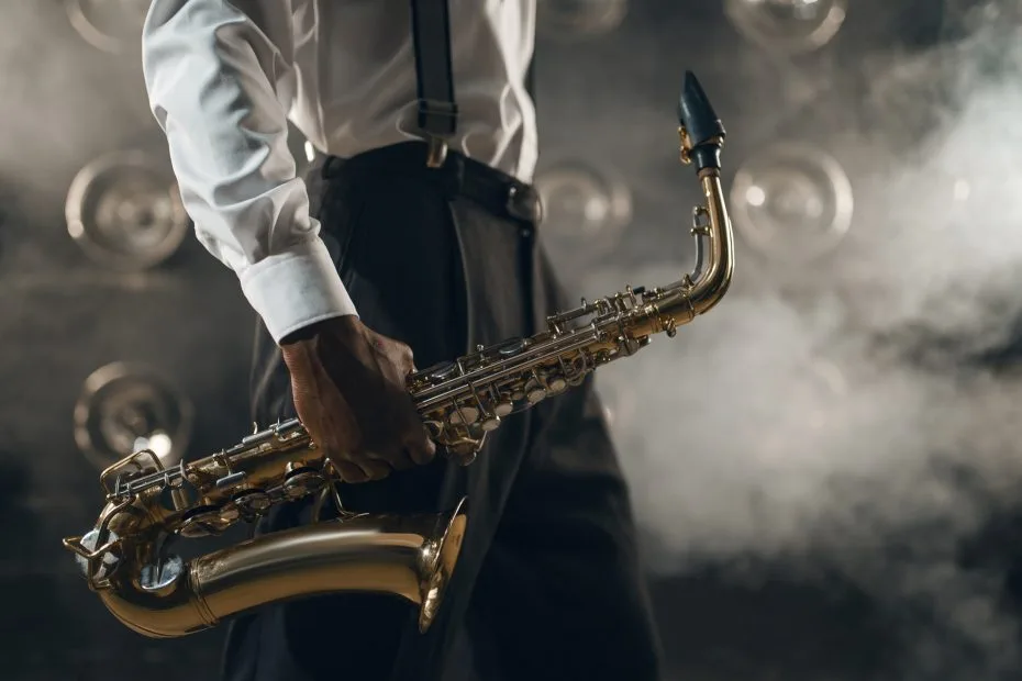 Black jazz musician with saxophone on the stage